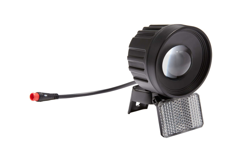 Replacement headlight with black plastic edging and a reflector below the headlight