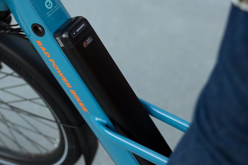 Safe Shield Advanced Semi-Integrated battery installed on a blue Radster Road electric commuter bike