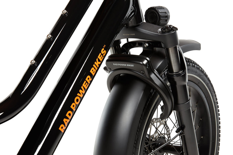 A Rad Fat Tire Wheel Lock mounted to a RadWagon 5 electric cargo bike, using the lock mount that needs to be purchased separately, but is not very visible once the lock is installed.