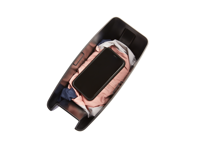 Top view of the RadRunner 3 Console showing a large phone and jacket stowed inside