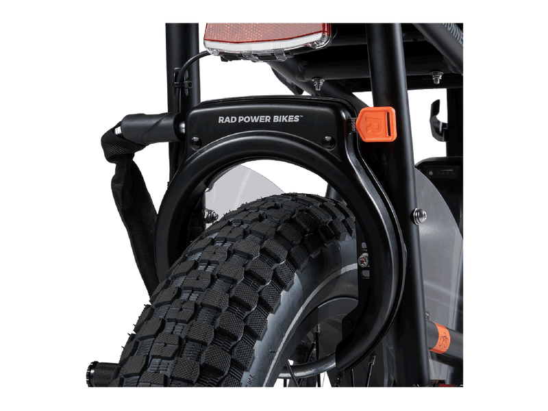 Rad Fat Tire Wheel Lock installed on an ebike, showing the orange key and with the optional security chain attached.